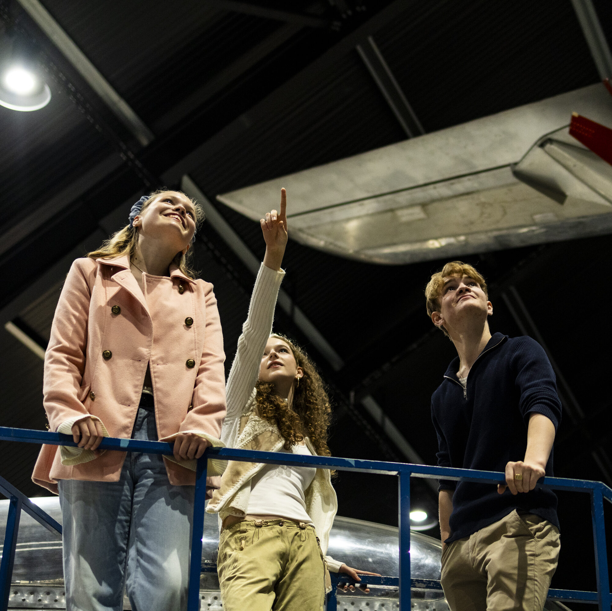 Young people enjoying the brand new exhibition of historic fighter jets at Flyhistorisk Museum Sola (Sola Aviation Museum)